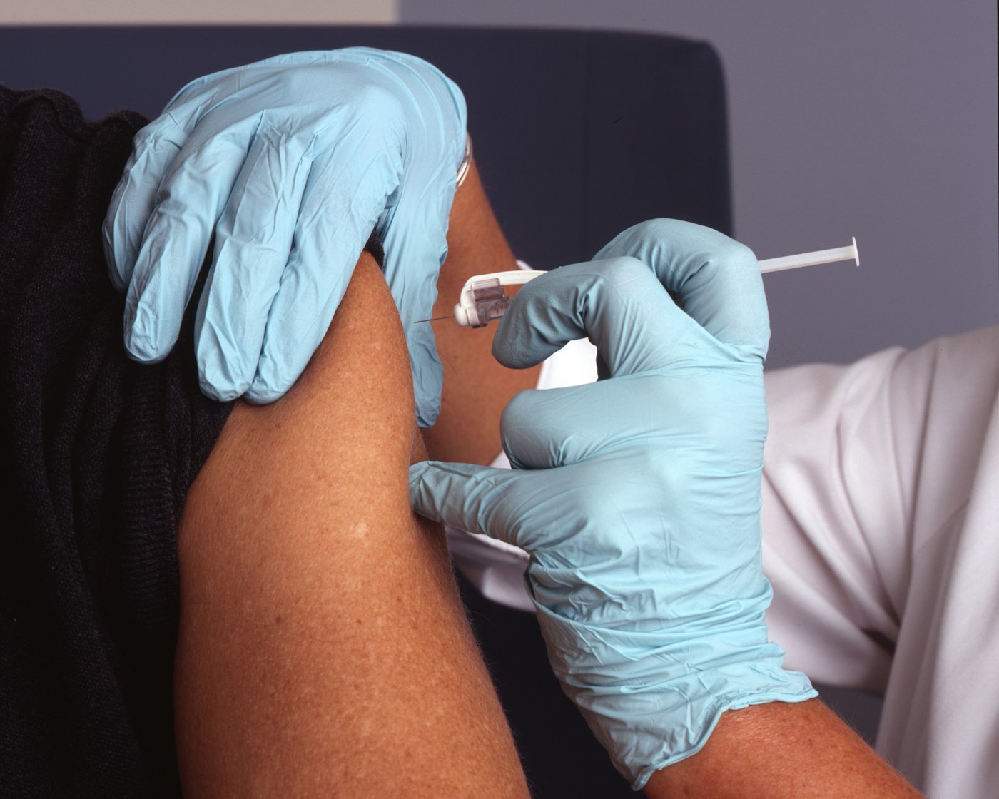 Trained professional preparing an at-home weight loss injection visit